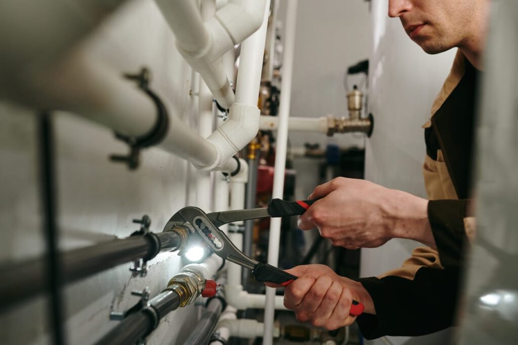 Plumbers maintaining commercial plumbing pipes in Bullhead City