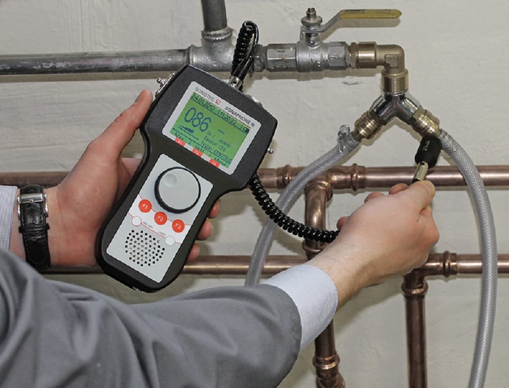Plumber testing pipes with electronic leak detection equipment in Bullhead City